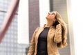 Confident brunette woman walking in the city. Royalty Free Stock Photo