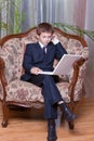 Confident business boy with computer and cell Royalty Free Stock Photo