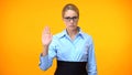 Confident business lady showing stop gesture hand, professional ethics, control