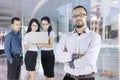 Confident business leader with his team in office Royalty Free Stock Photo