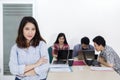 Confident business leader stands with her team Royalty Free Stock Photo