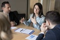 Confident business leader woman talking to colleagues on corporate meeting Royalty Free Stock Photo