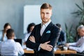 Confident Business Man Standing In Front Of Employess In Office Royalty Free Stock Photo