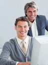 Confident business partners working at a computer Royalty Free Stock Photo