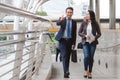 Confident business people walking to work at office and talking together Royalty Free Stock Photo