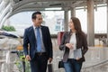 Confident business people walking to work at office and talking together Royalty Free Stock Photo