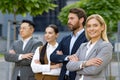 Confident business professionals standing outdoors in a line Royalty Free Stock Photo