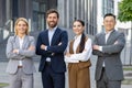 Confident business team standing outside office building Royalty Free Stock Photo