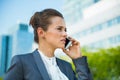 Confident business woman in office district talking smartphone Royalty Free Stock Photo