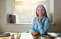 Confident business woman sitting at desk Royalty Free Stock Photo