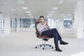 Confident Businessman On Chair In New Office Royalty Free Stock Photo