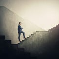 Confident businessman climbing an endless staircase with ups and downs, determined to reach the end and achieve success. Infinite