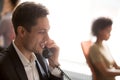 Confident businessman employee talking on phone close up