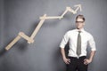 Confident businessman with graph. Royalty Free Stock Photo