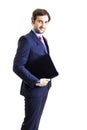 Confident businessman holding a laptop Royalty Free Stock Photo