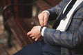Confident businessman looking on his wrist watch in suit Royalty Free Stock Photo