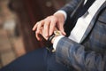 Confident businessman looking on his wrist watch in suit Royalty Free Stock Photo