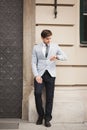 Confident businessman looking on his wrist watch in suit Royalty Free Stock Photo