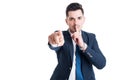 Confident businessman making keep a secret and silence gesture Royalty Free Stock Photo