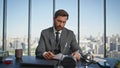 Confident businessman signing contract at desk. Smiling financial manager work Royalty Free Stock Photo