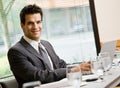 Confident businessman sitting in conference room