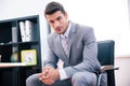 Confident businessman sitting on the office chair Royalty Free Stock Photo