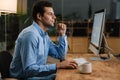 Confident businessman sitting at office desk Royalty Free Stock Photo