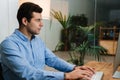 Confident businessman sitting at office desk Royalty Free Stock Photo