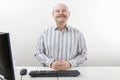 Confident Businessman Smiling At Computer Desk Royalty Free Stock Photo