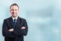 Confident businessman smiling and holding arms crossed Royalty Free Stock Photo