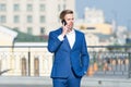 Confident businessman speaking on phone. making business on move. business man with mobile phone. wireless connection Royalty Free Stock Photo