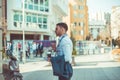 Confident businessman standing and taking his sunglasses off Royalty Free Stock Photo