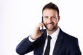 Confident businessman talking with somebody on his mobile phone while standing at isolated white background Royalty Free Stock Photo