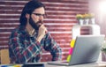 Confident businessman using laptop on desk Royalty Free Stock Photo