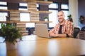 Confident businessman using laptop at desk Royalty Free Stock Photo