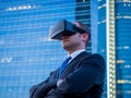 Confident businessman using virtual reality glasses in a business center Royalty Free Stock Photo