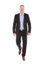 Confident Businessman Walking Over White Background Royalty Free Stock Photo