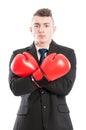 Confident businessman wearing boxing gloves and arms crossed Royalty Free Stock Photo