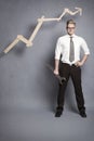 Confident businessman with wrench and graph. Royalty Free Stock Photo