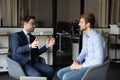 Confident businessmen discussing project, partners negotiations in office Royalty Free Stock Photo