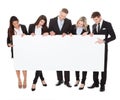 Confident businesspeople holding blank banner Royalty Free Stock Photo