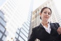 Confident Businesswoman Against Office Buildings