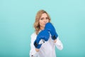 confident businesswoman in boxing gloves. punching. successful ceo boxer. Royalty Free Stock Photo