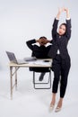 Confident businesswoman and businessman in office with stretch in office. Royalty Free Stock Photo