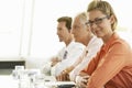 Confident Businesswoman With Colleagues In Conference Room Royalty Free Stock Photo