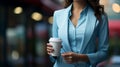 Confident businesswoman enjoys coffee