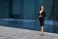 Confident businesswoman in front of modern office building. Business, banking, corporation and financial market concept. Royalty Free Stock Photo