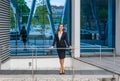 Confident businesswoman in front of modern office building. Business, banking, corporation and financial market concept. Royalty Free Stock Photo