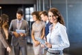 Confident businesswoman looking at camera in office Royalty Free Stock Photo