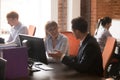 Confident businesswoman mentor teaching employee, using computer Royalty Free Stock Photo